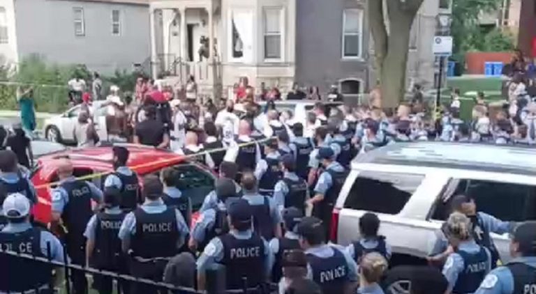 Nene Pollion shared a live video, on Facebook, of hundreds of police officers shutting a street down. The Facebook comments, from eyewitnesses would explain that a fifteen-year-old black boy was shot in the face by a police officer and the witnesses jumped the officer, leading to him calling for backup. As the boy was rushed to the hospital, fighting for his life, the police officers took over thsi neighborhood.