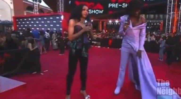 Lil Nas X asks reporter if his VMAs outfit looks good and he laughs and says I won't say all that