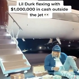 Lil Durk counts 1 million dollars cash in front of private jet