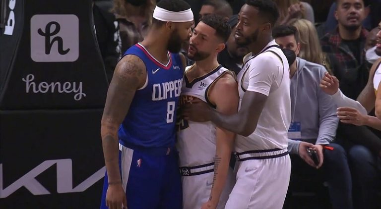 Austin Rivers tries to fight Marcus Morris after he elbowed him