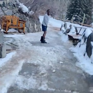 Boosie runs in the snow wearing his underwear