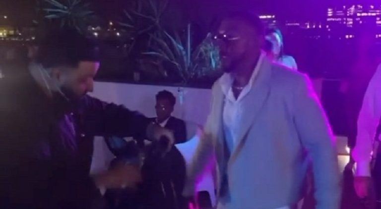 DJ Khaled gives Timbaland a Louis Vuitton bag that lights up