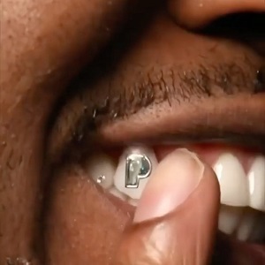 Gunna gets 100K P diamond in his tooth to celebrate Pushin P