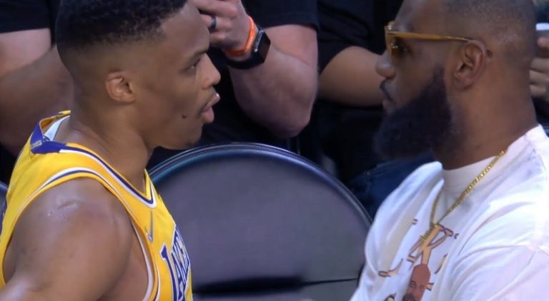 LeBron James talks to Russell Westbrook after offensive foul
