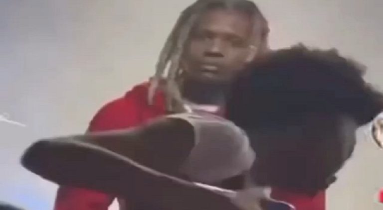 Lil Durk looks confused as a fan passed out during his concert