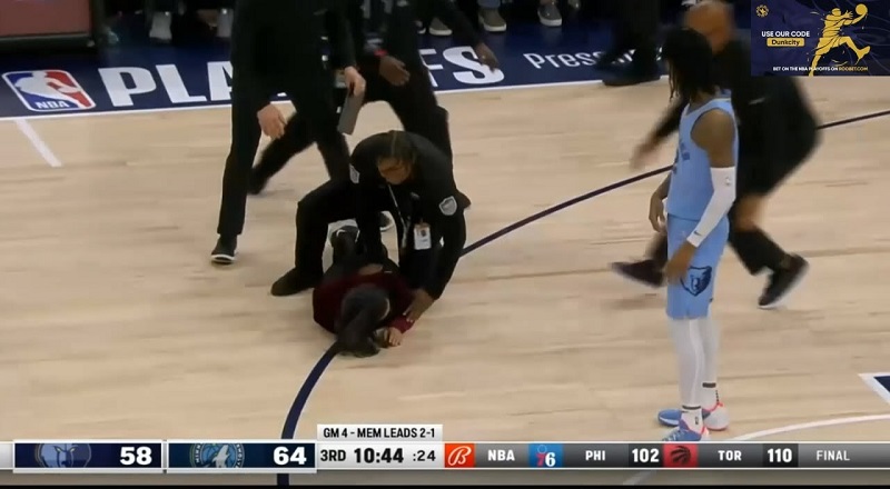 Two fans run onto the court during Timberwolves - Grizzlies Game 4
