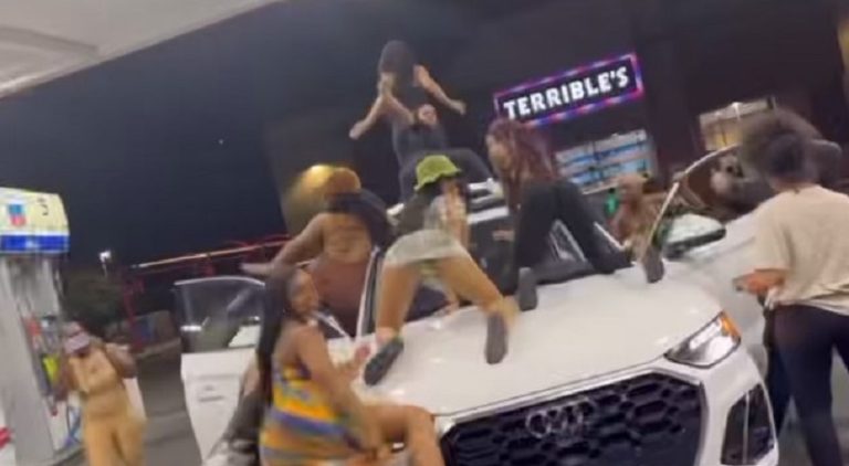 Yaya Mayweather and her friends twerk on a car at the gas station