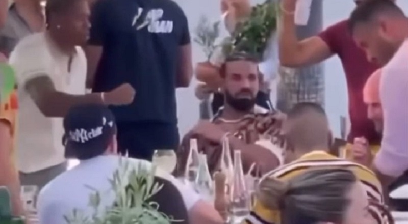Drake's entourage frantically swats bee to stop it from stinging him