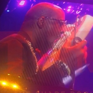 Wyclef Jean plays the guitar with his tongue at Essence Fest