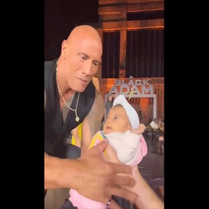 Fans crowd surfed a baby into Dwayne Johnson's arms onstage