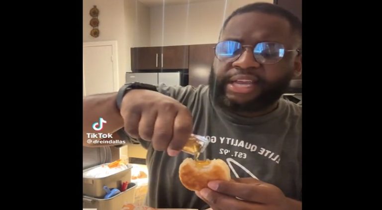 Man eats whole Popeyes biscuit and drenches it in honey