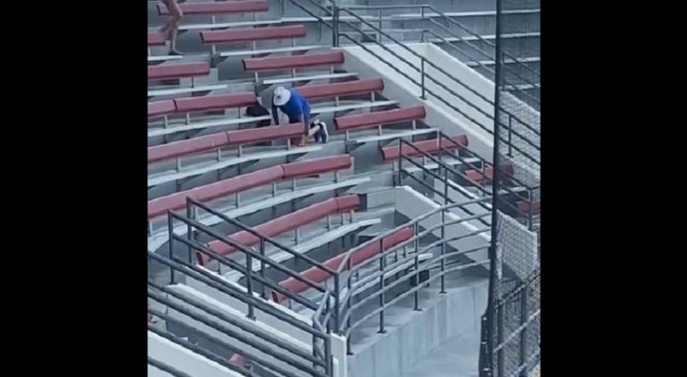 Man has awkward fall from stadium bleachers