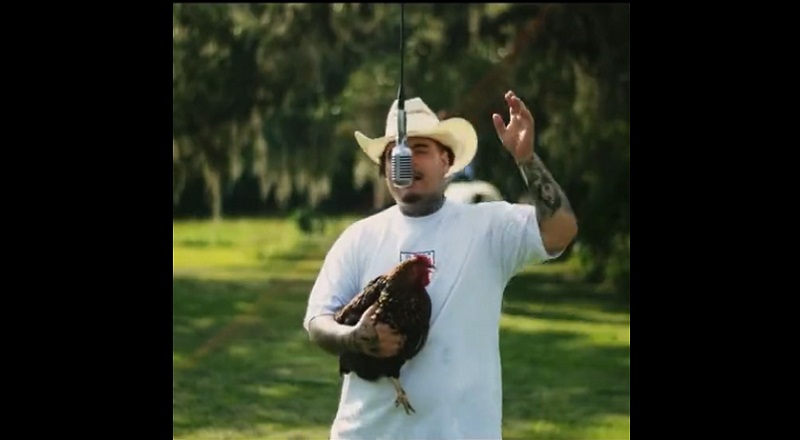 That Mexican OT raps while holding live chicken in new video