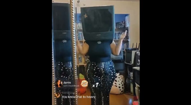 Woman wears a TV as a mask in order to gain Facebook points