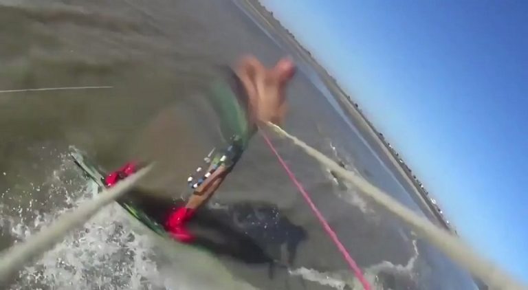 Kite surfer gets attacked by a pit bull on the beach