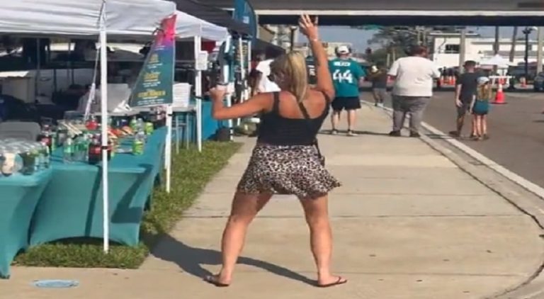 Man proudly claims his wife as she drunk dances on sidewalk