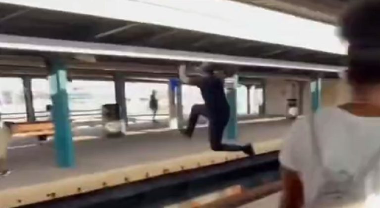 Man steals woman's wig and jumps over train tracks with it