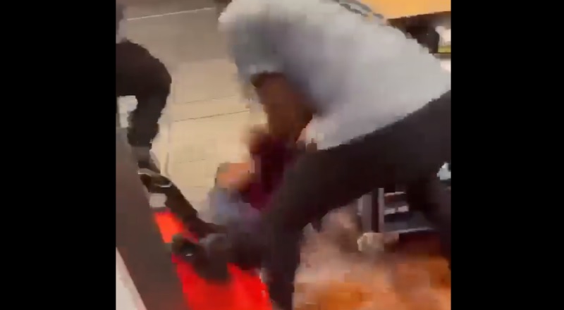 Woman slams co-worker to the ground into dirty water