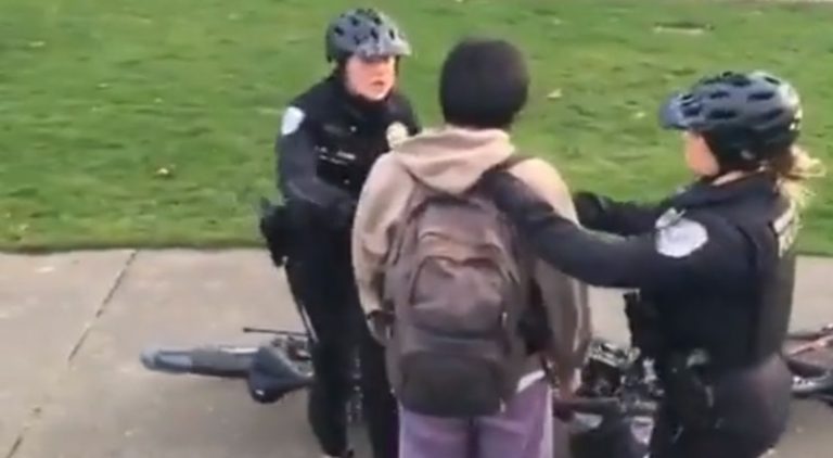 Female police officers arrest man for skateboarding past them