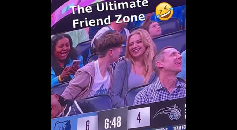 Man tries to kiss woman on kiss cam and she avoids it