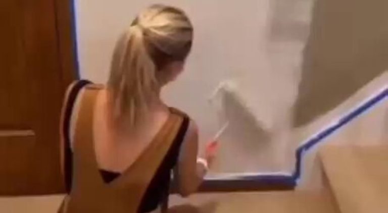 Woman gets confused by her own shadow while painting