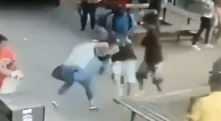 Crazed man attacks woman and gets beaten by five men
